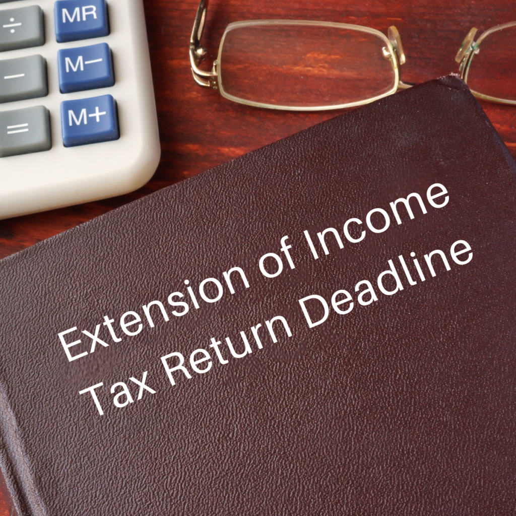 Tax alert graphic on the Extension of Income Tax Return Deadline, with a calculator, glasses, and a leather-bound folder on a desk.